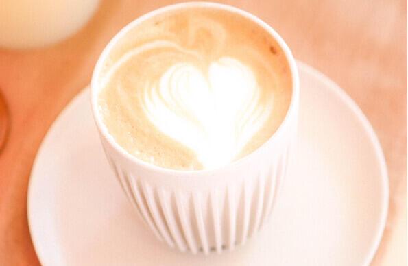 A coffee with a heart latte art from BADU Cafe