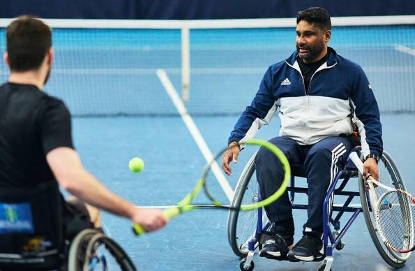 Two men in wheelchairs playing Tennis at Lee Valley Hockey & Tennis Centre