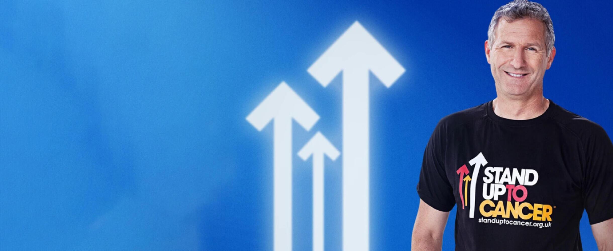 Prsenter Adam Hill stands in front of a blue background