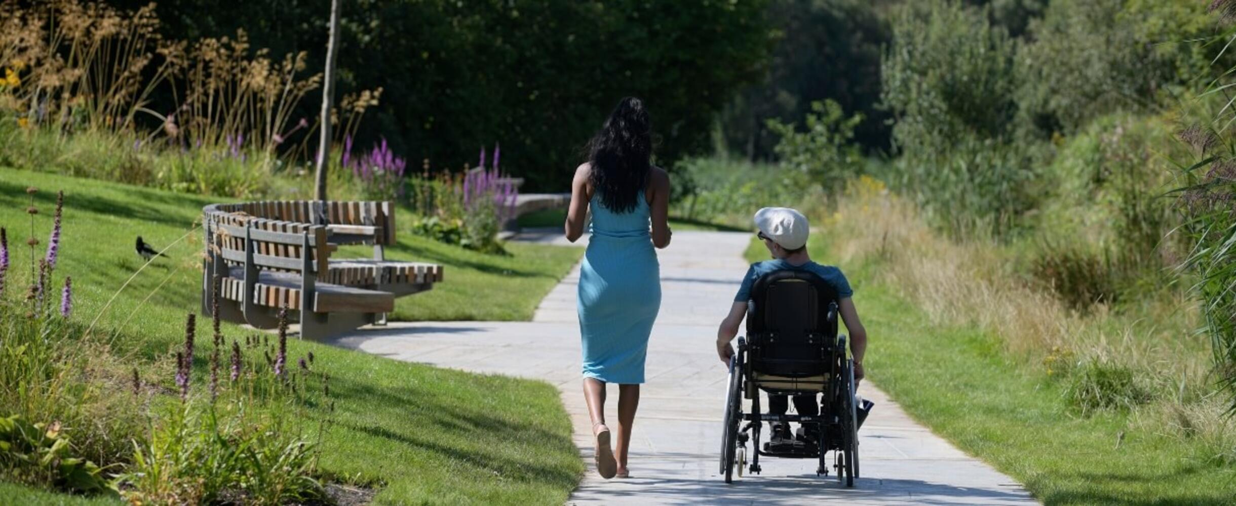 Wheelchair user going through London Blossom Garden