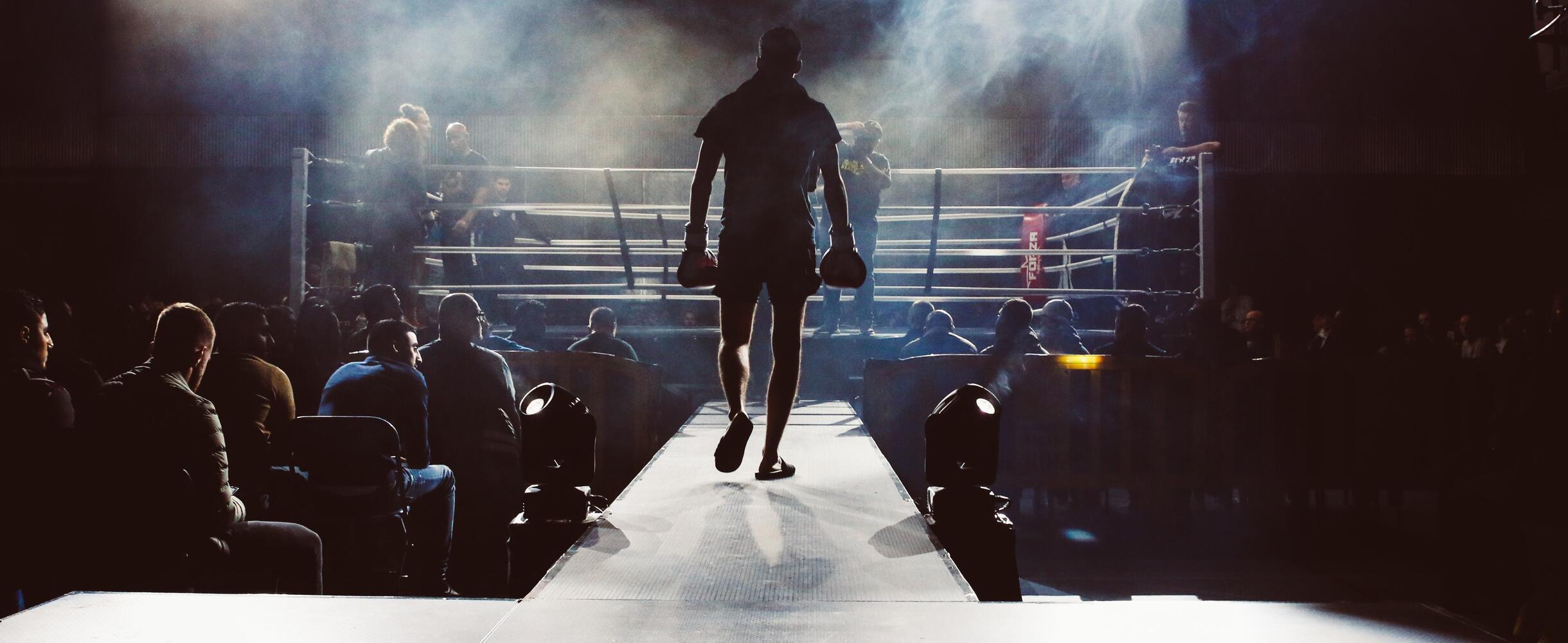 Person walks into boxing ring