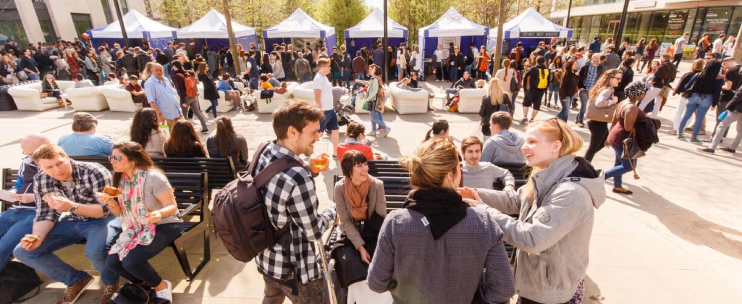 A group of people at an East Village market