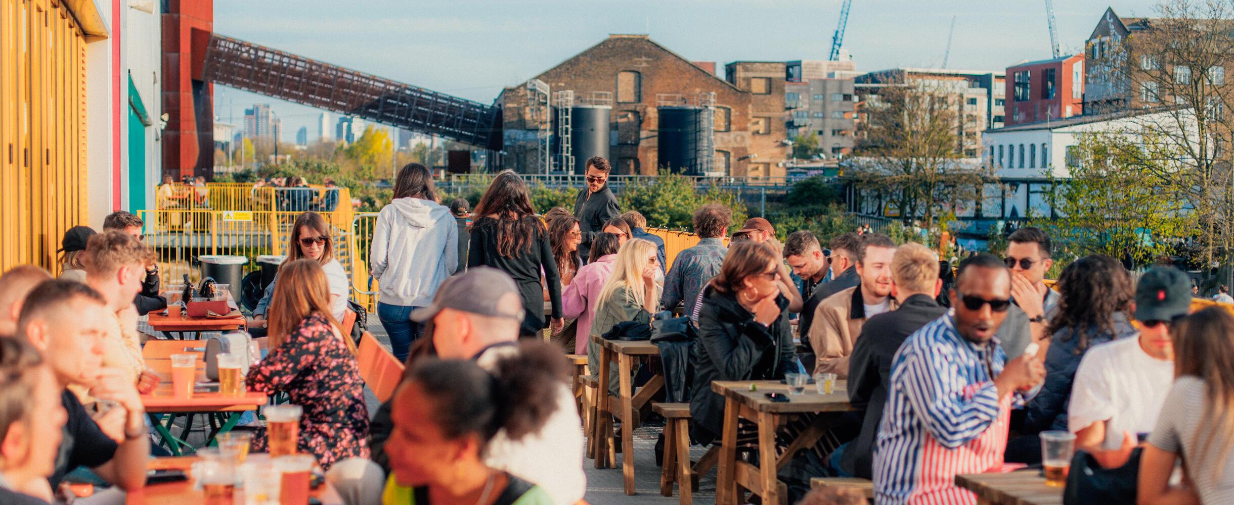 People eating and drinking at Hackney Bridge