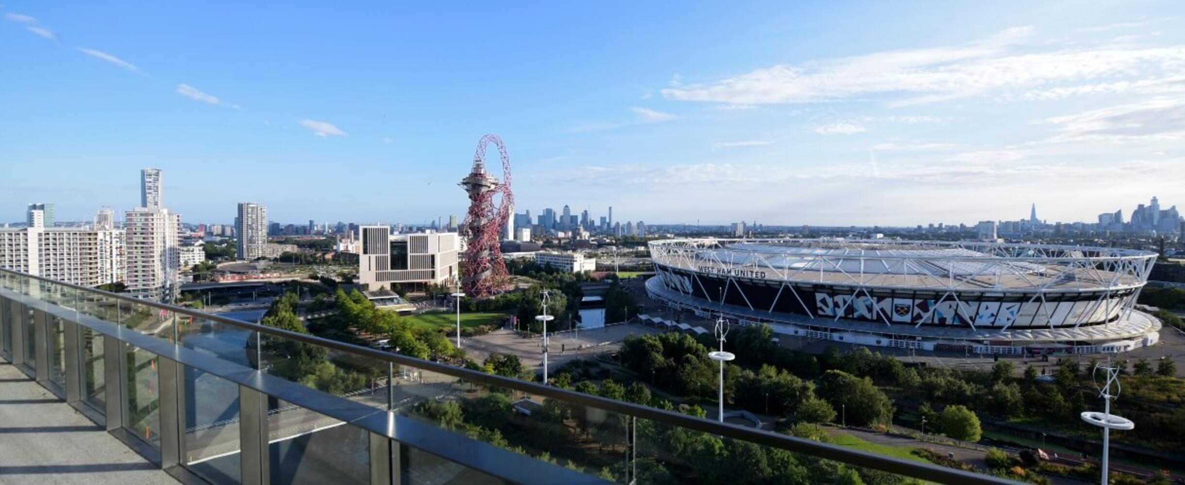 Beautiful shot of the Park from a balcony, featuring the ArcelorMittal Orbit and London Stadium
