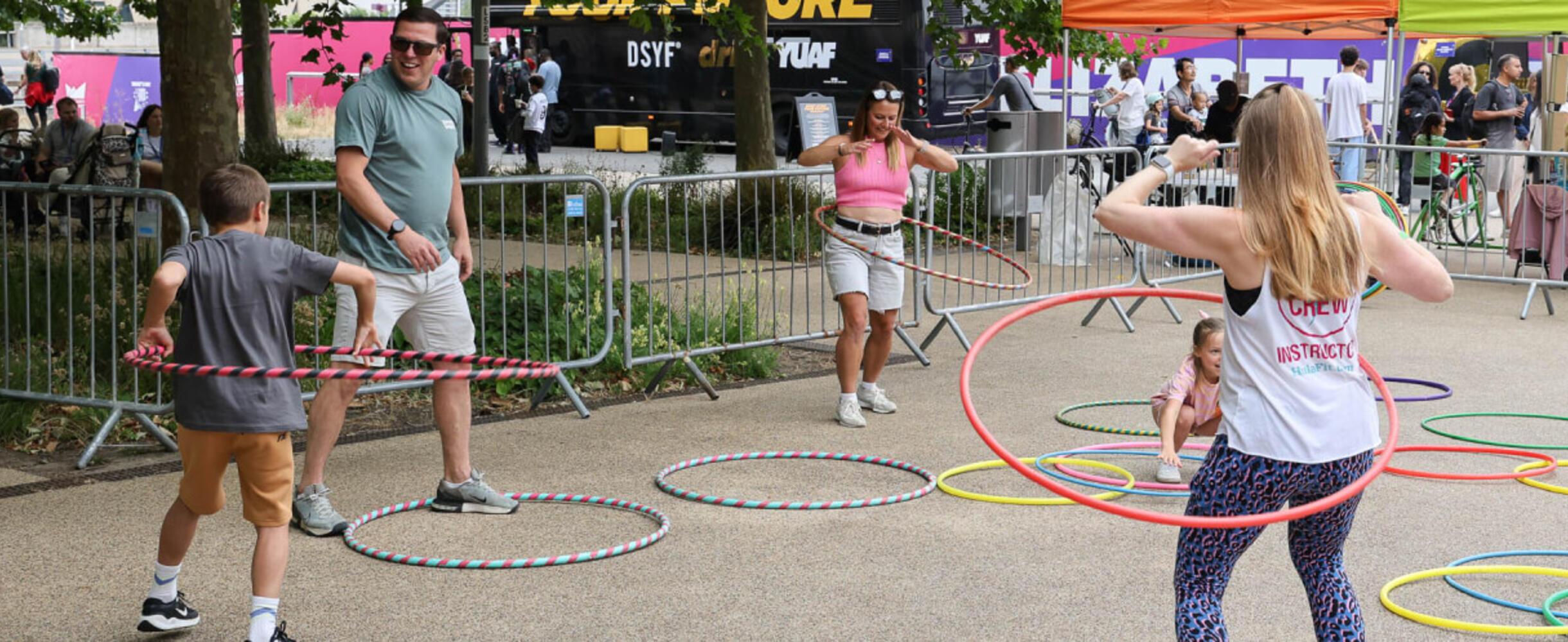 A family use hula-hoops at London Youth Games
