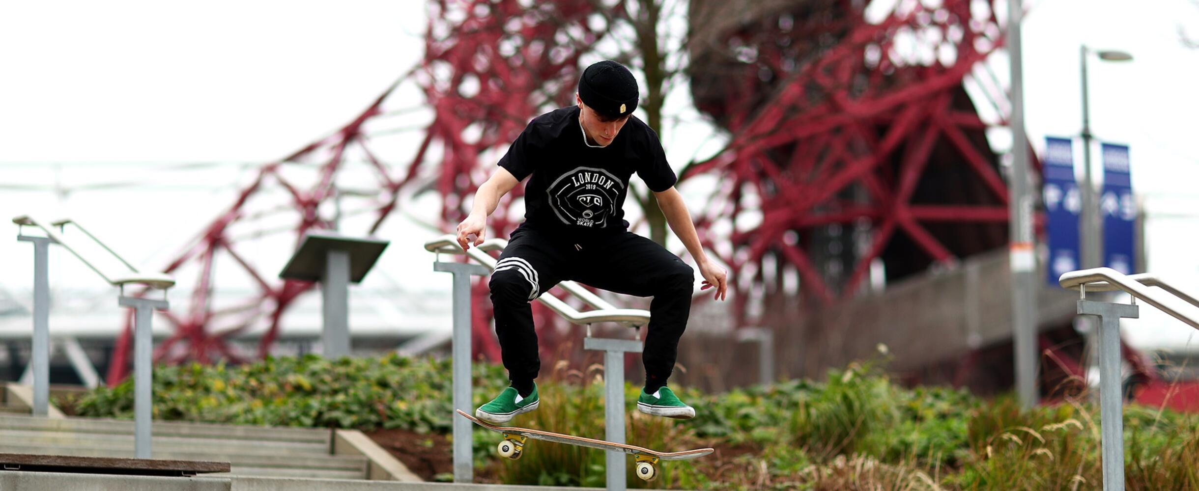 Skateboarder doing a trick by set of stairs
