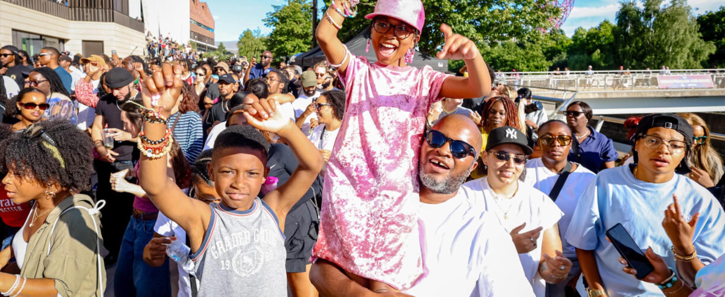 A family enjoys the music is black festival