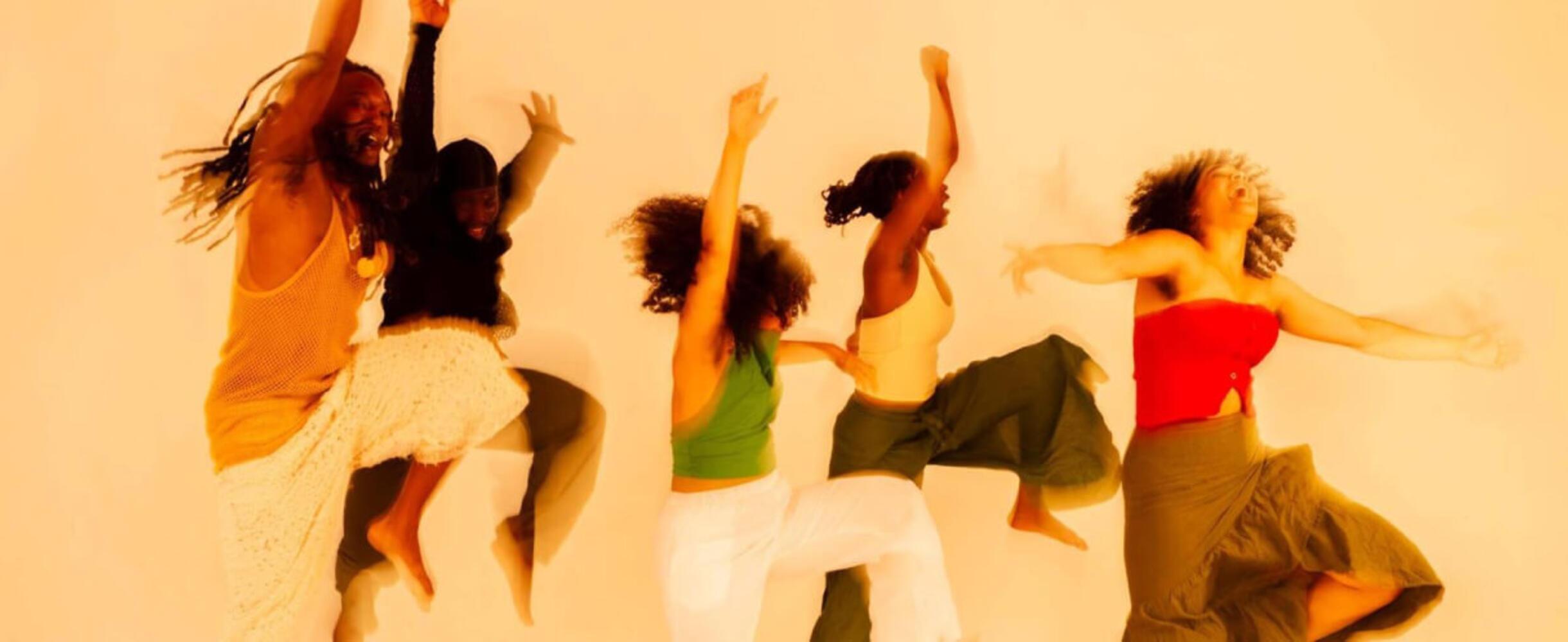 A group of people jump and dance © Solomon Charles-Kelly