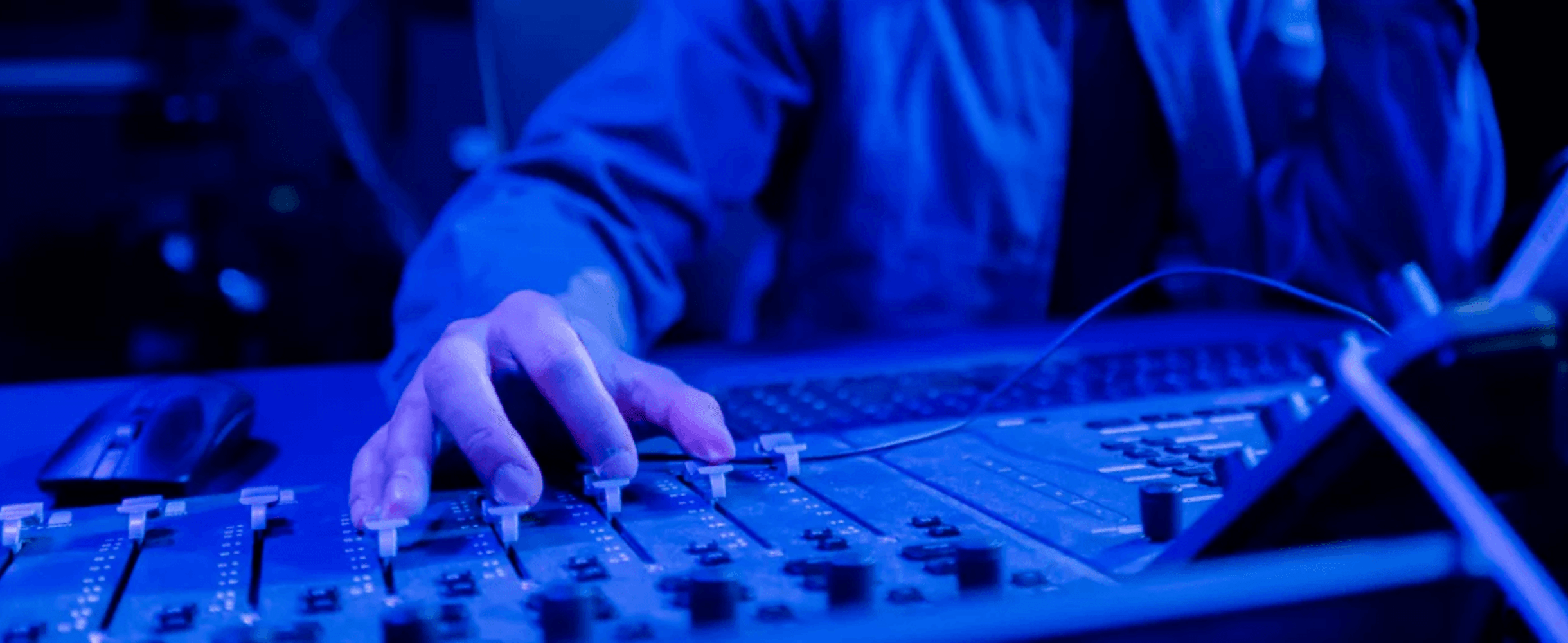 A sound engineer working on a deck