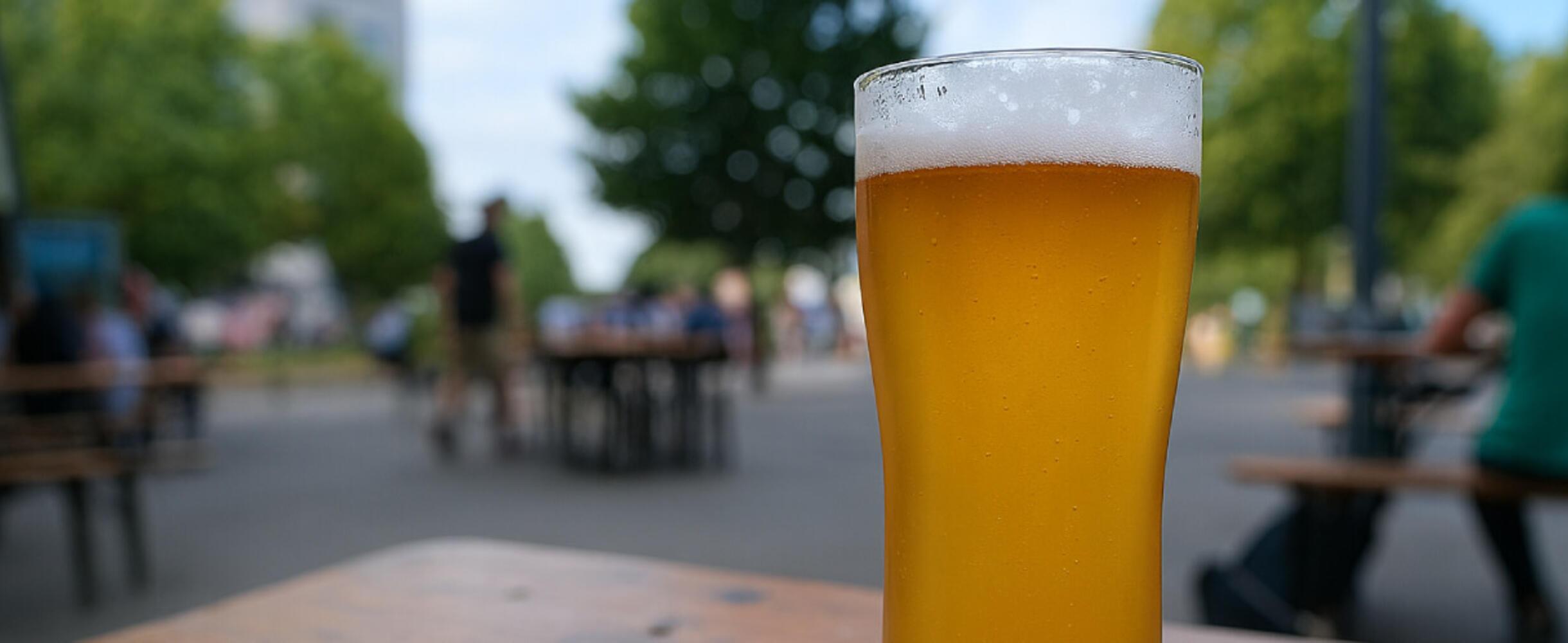 A beer glass outside on a table