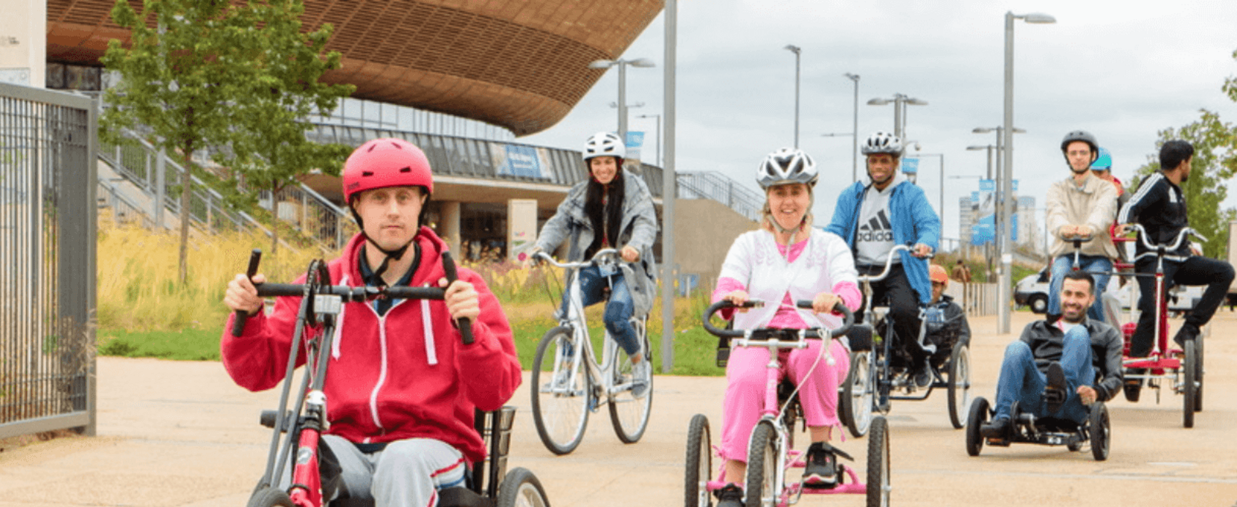 A group of people cycling on different bikes