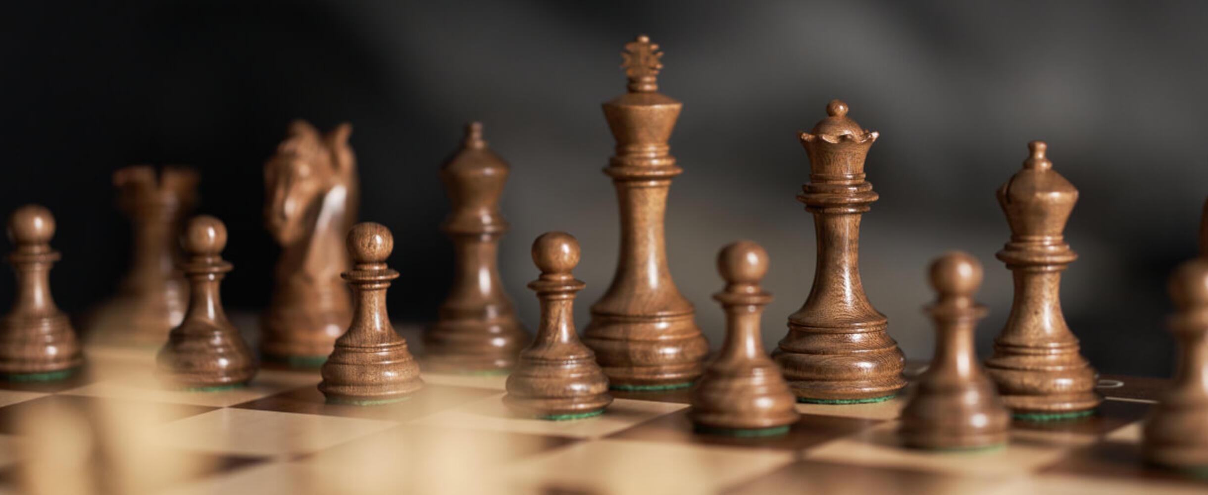 A chess board is set up for a new game