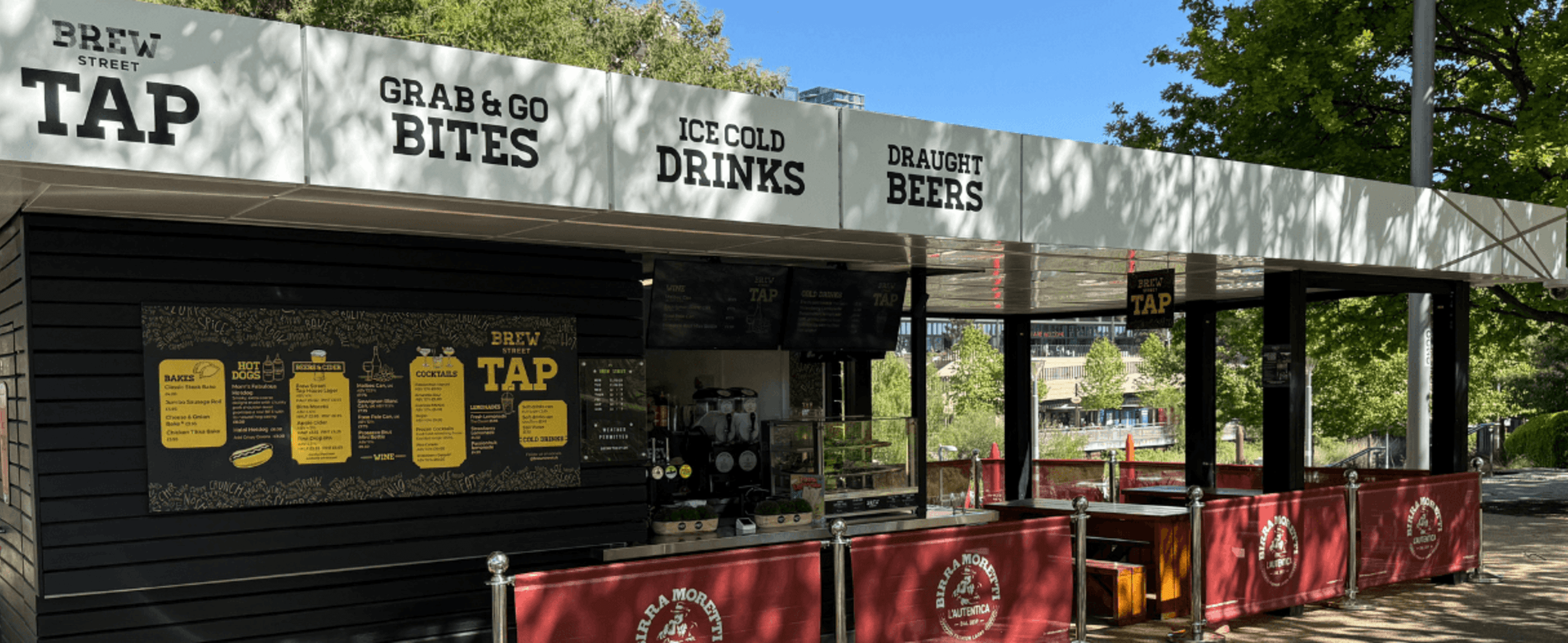 A F&B kiosk with terrace surrounded by leafy trees