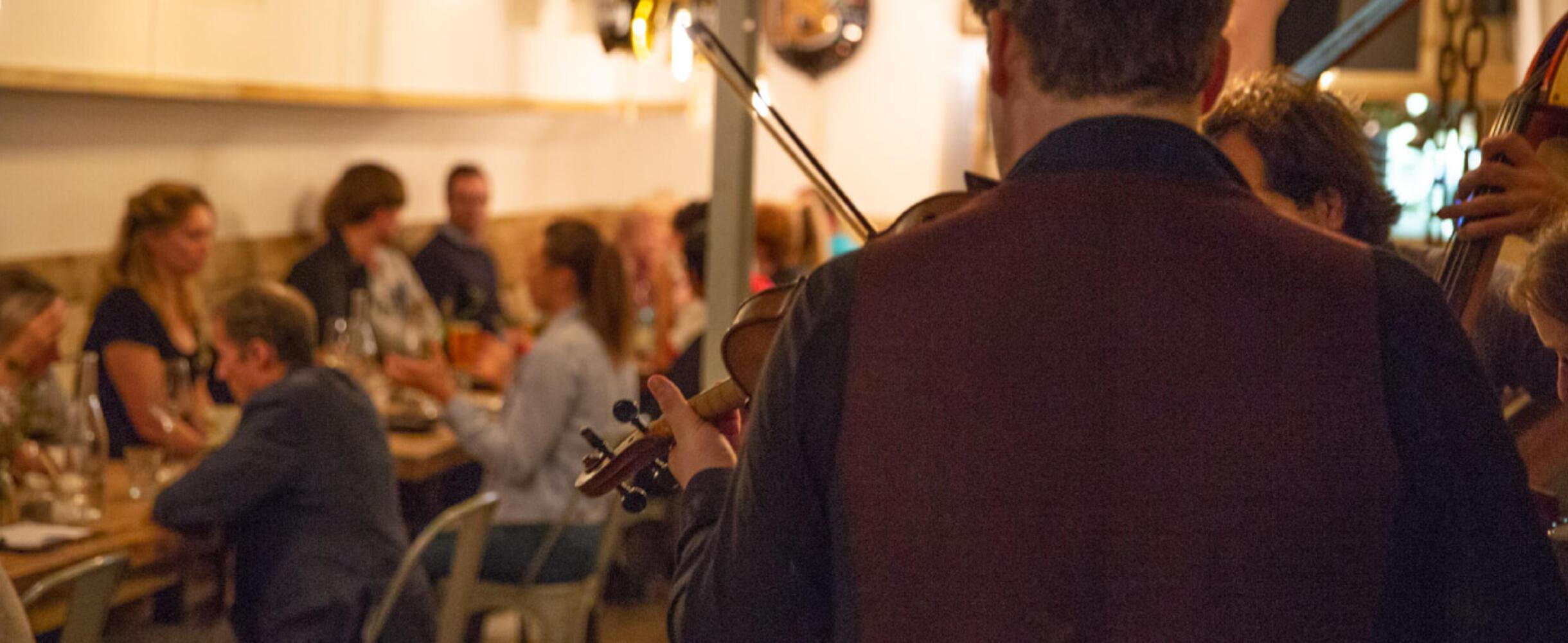 A band play in front of diners at Burns night at Barge East