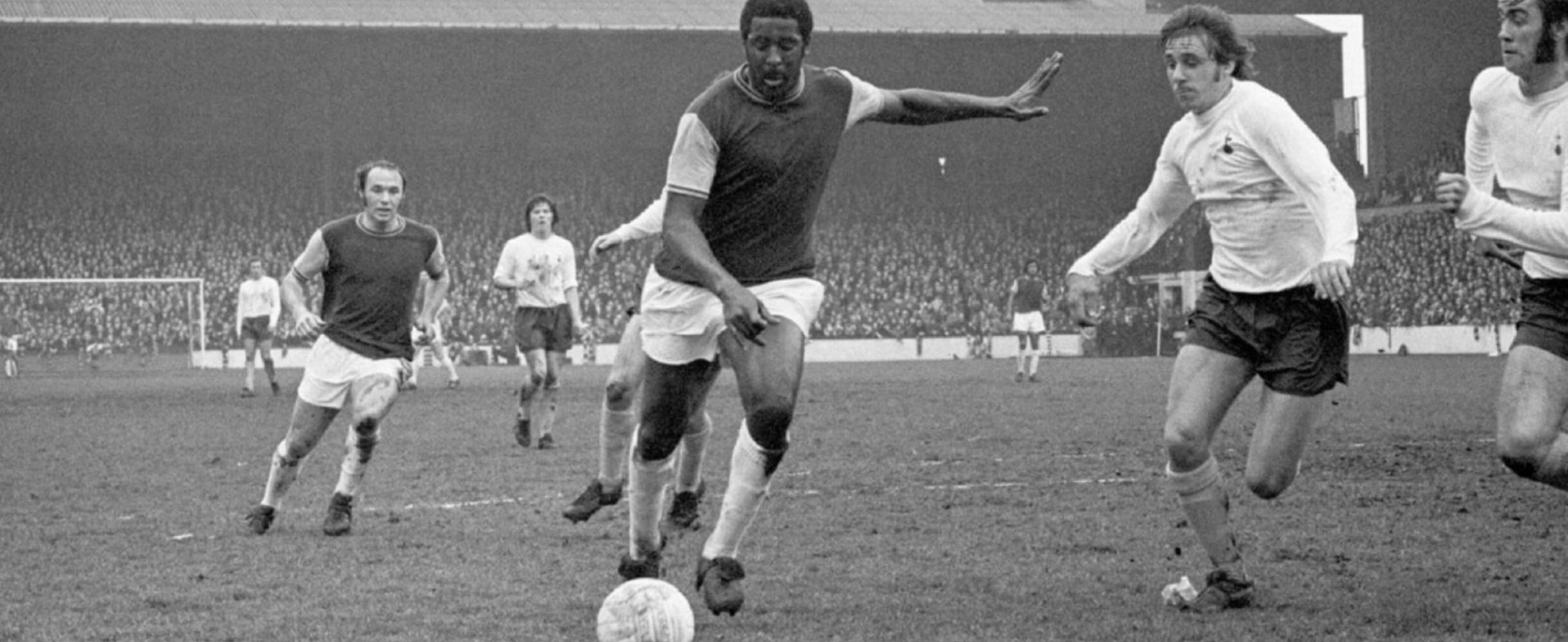 Clyde Best plays football in black and white