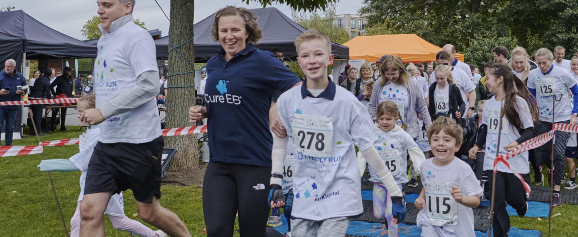 A group of people of different ages start the Cure EB Run