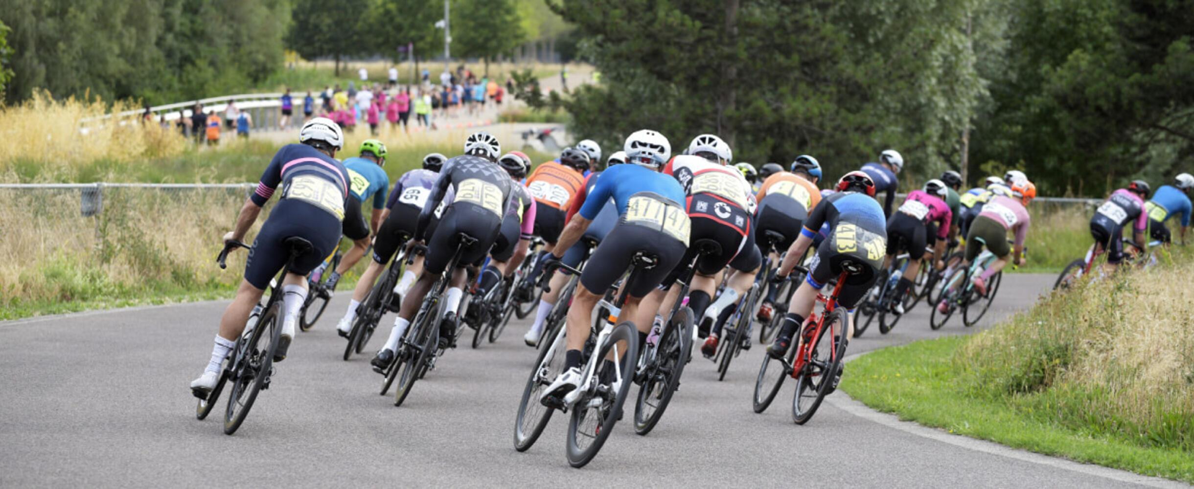 A group of cyclists round a corner of the Road track at Lee Valley VeloPark