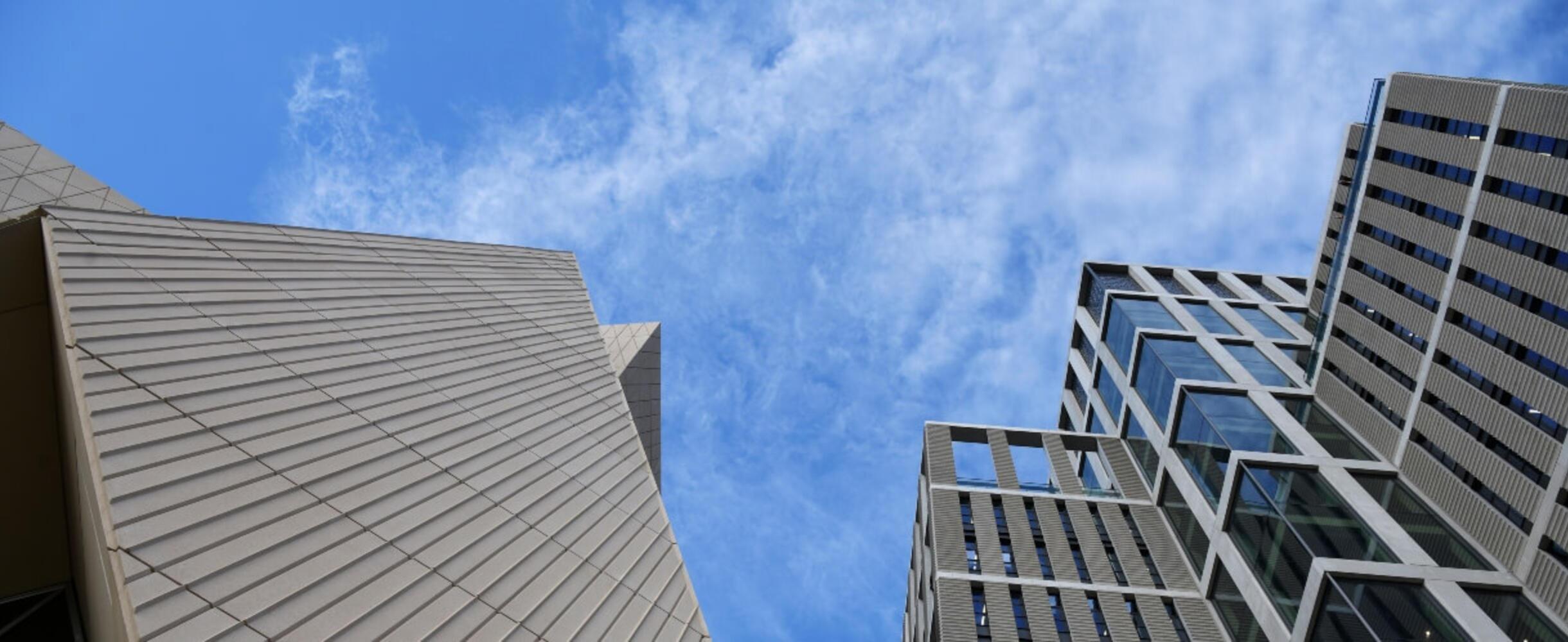 A shot from the ground of high buildings at East Bank
