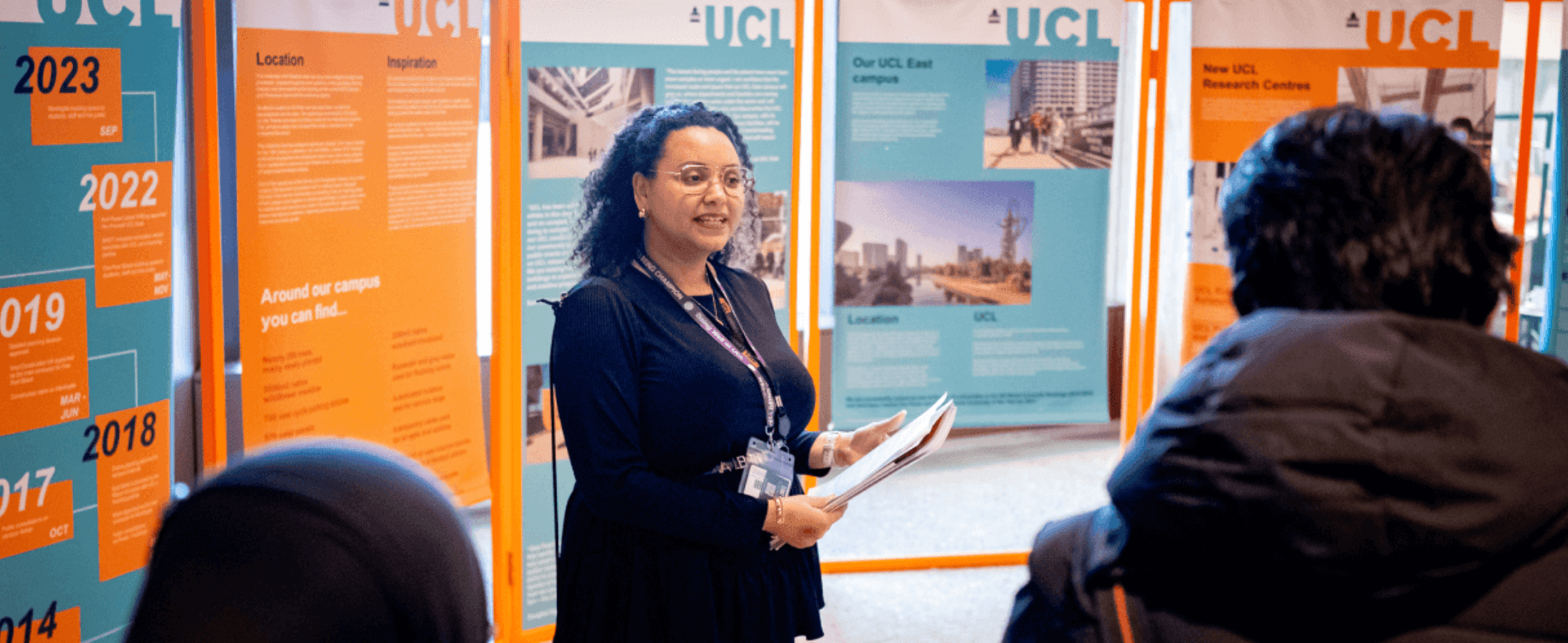A UCL facilitator stands in front of students at East Careers Week