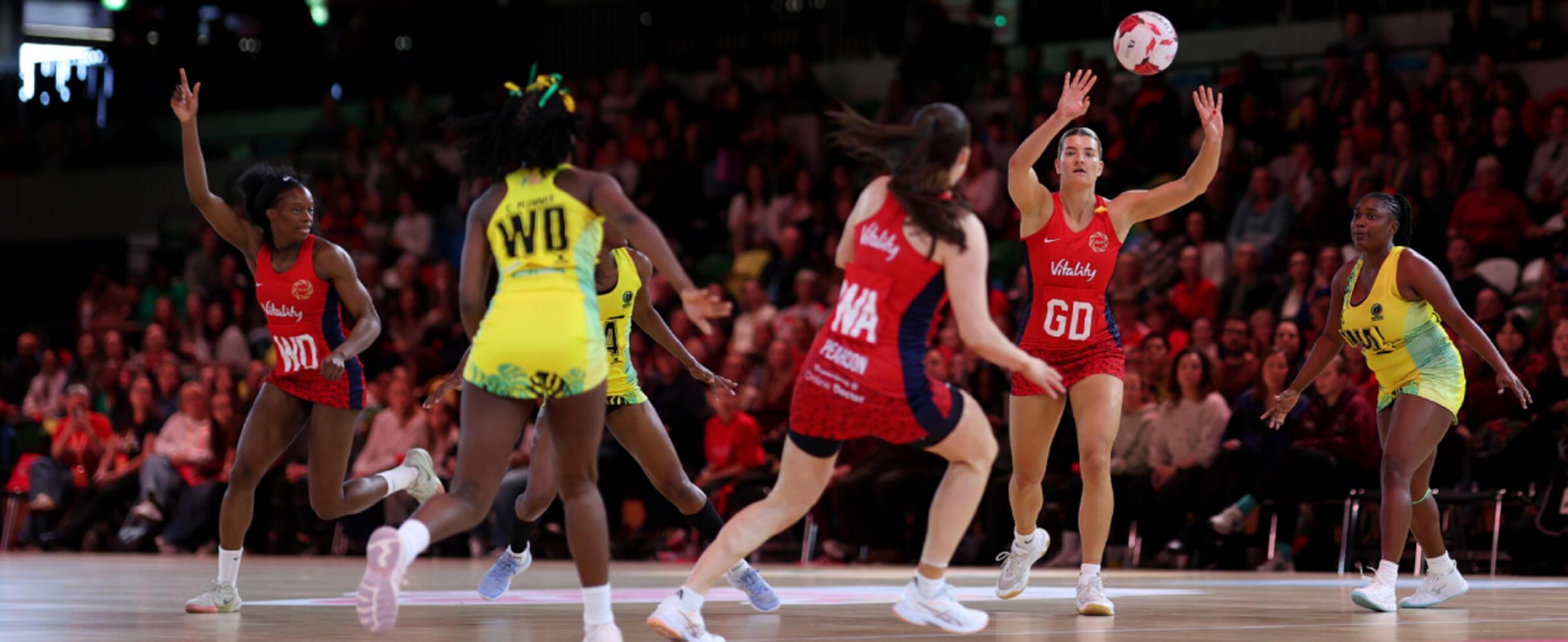 An England netball player passes the ball