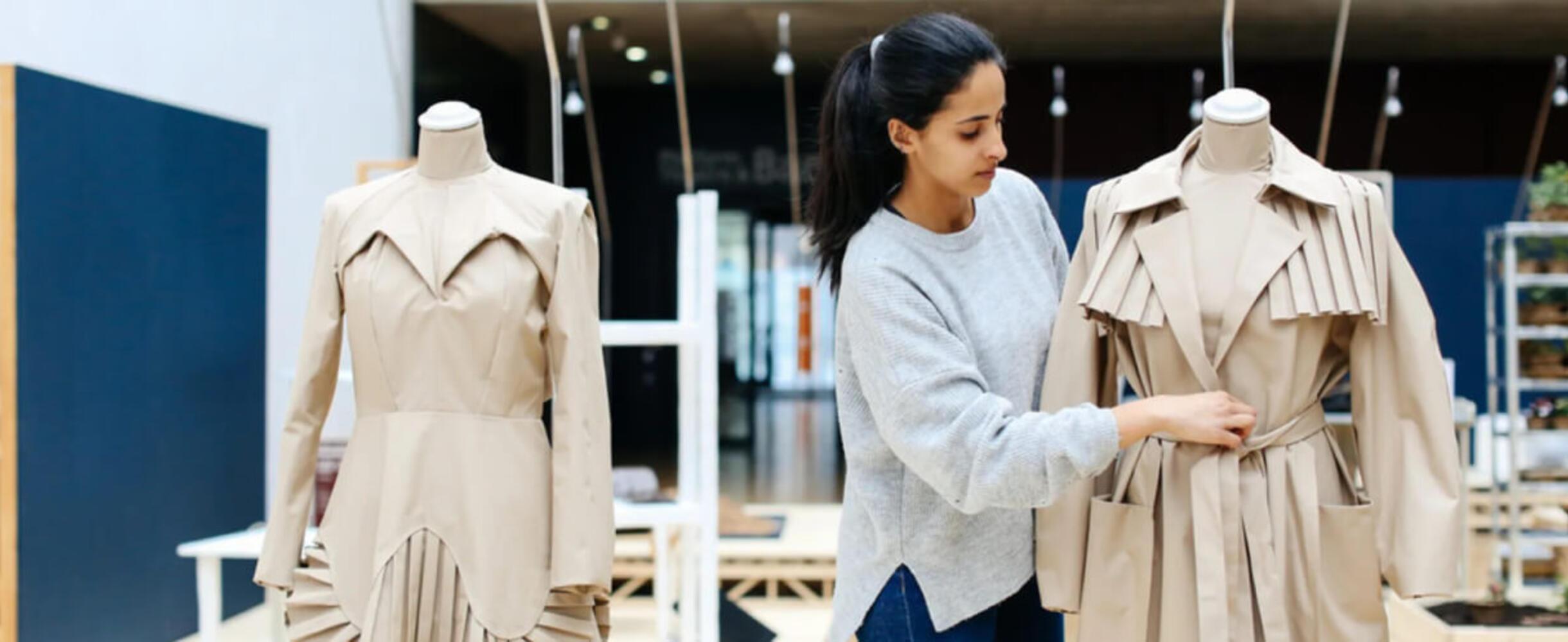 Designer with a coat at a London College of Fashion Summer Course