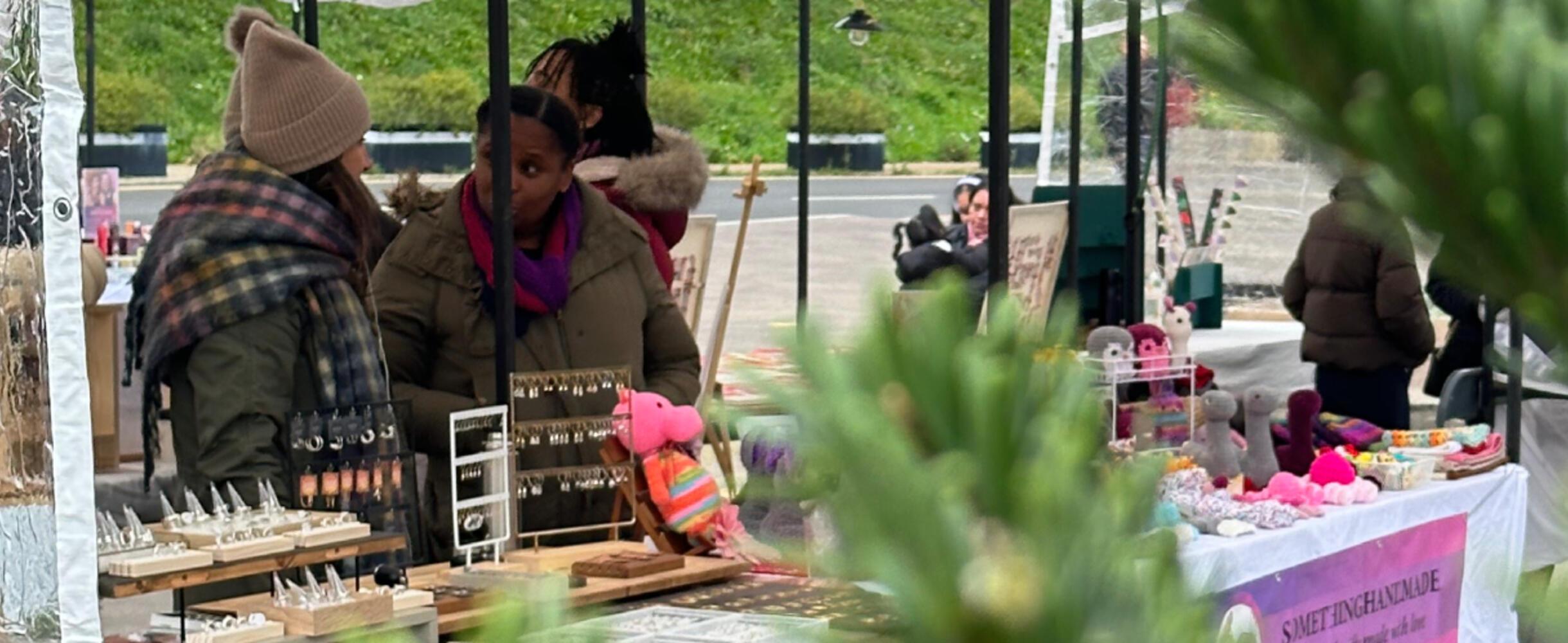 Two market stalls at Hackney Bridge Christmas market