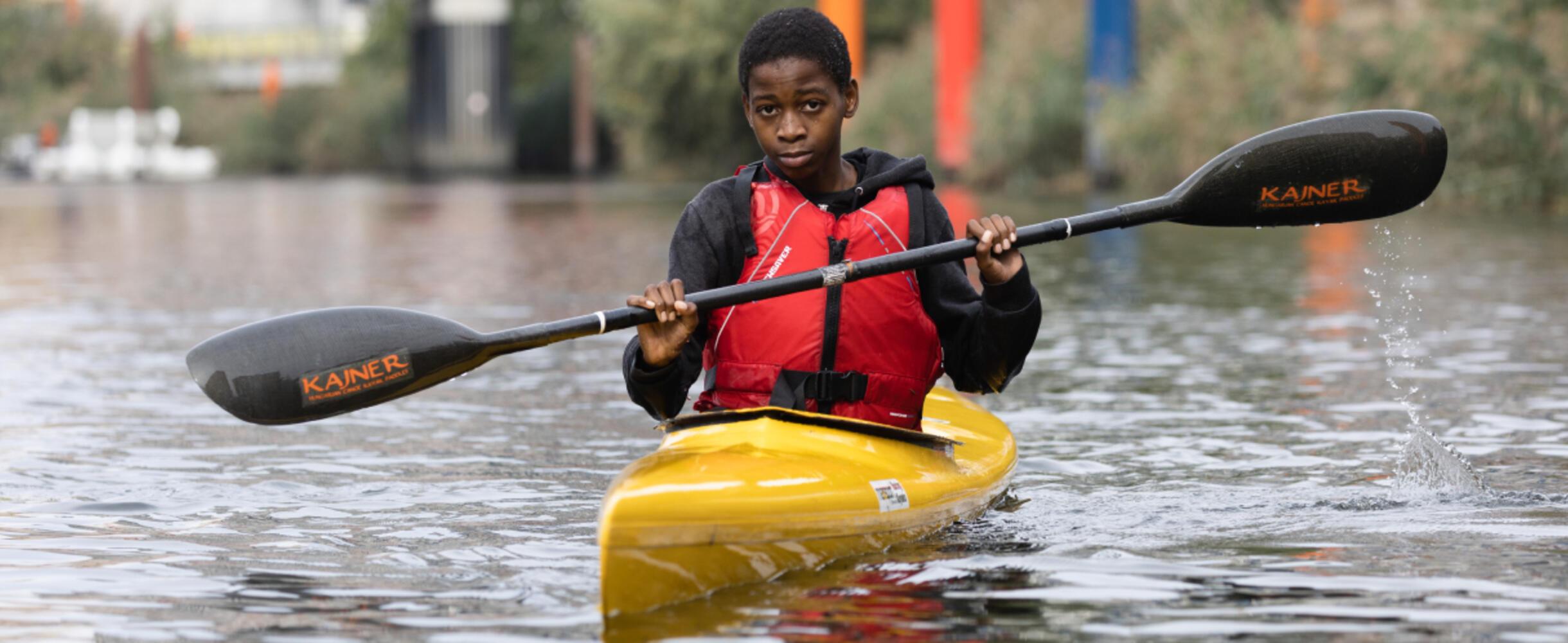 A young adult in a canoe 