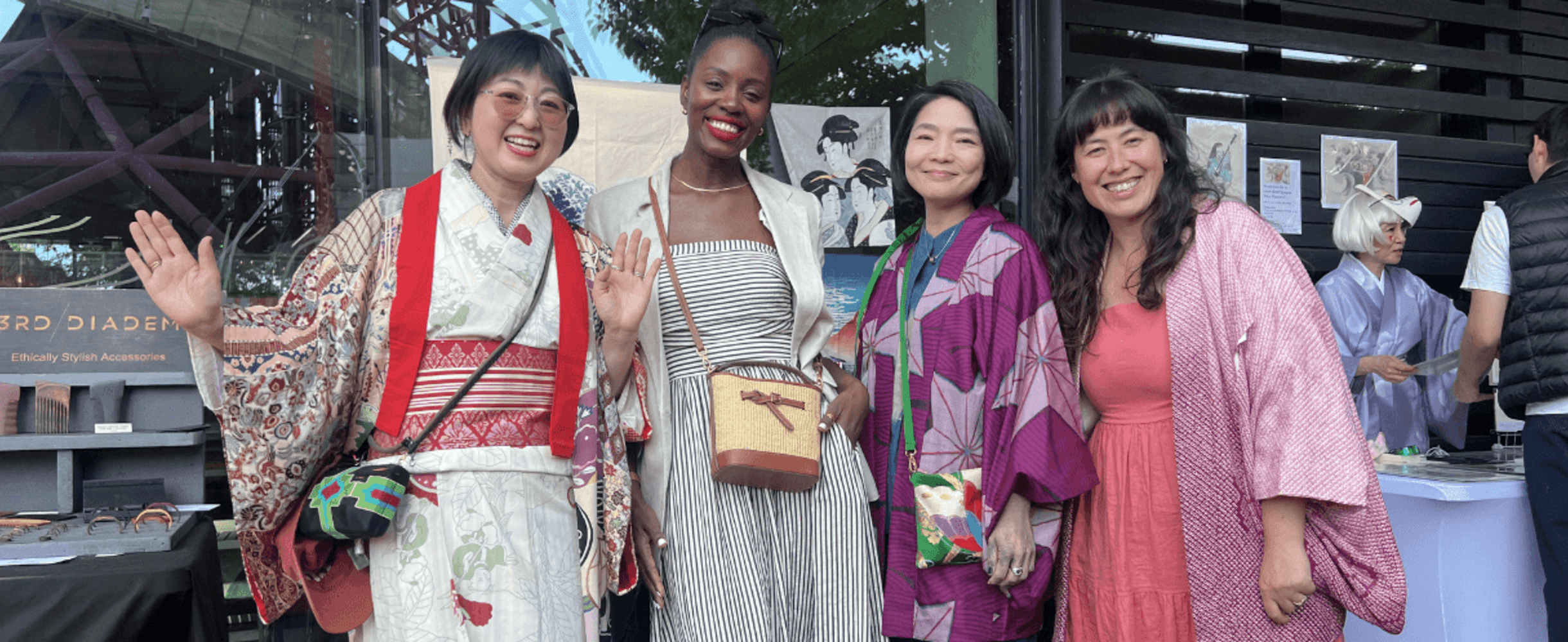 A group of women smiling at a market