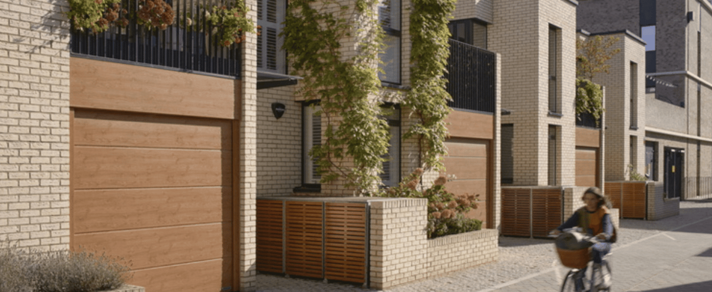Girl cycling in a residential estate 