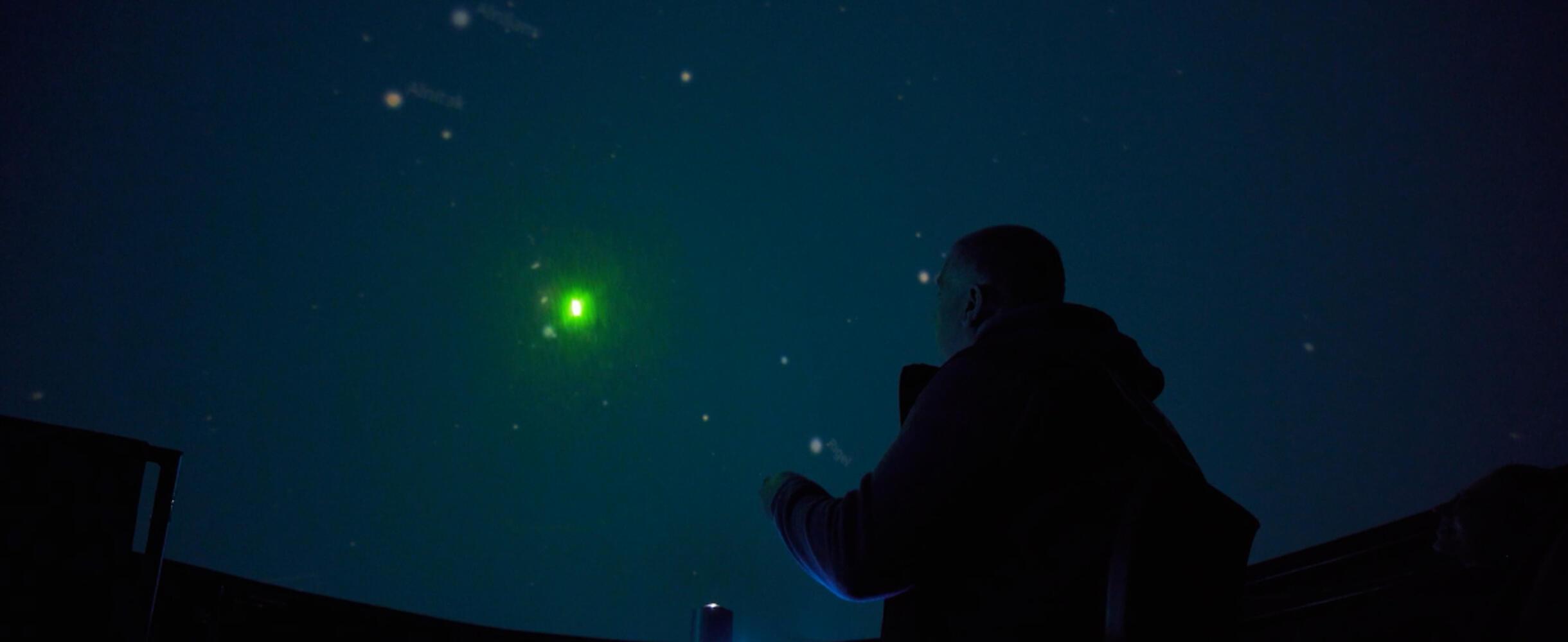 A person enjoys a planetarium