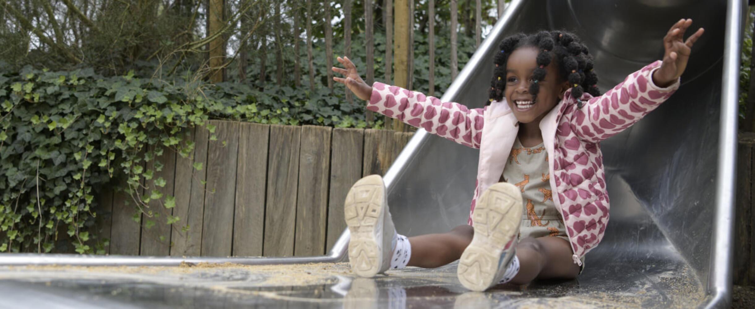 A child goes down a slide at Queen Elizabeth Olympic Park