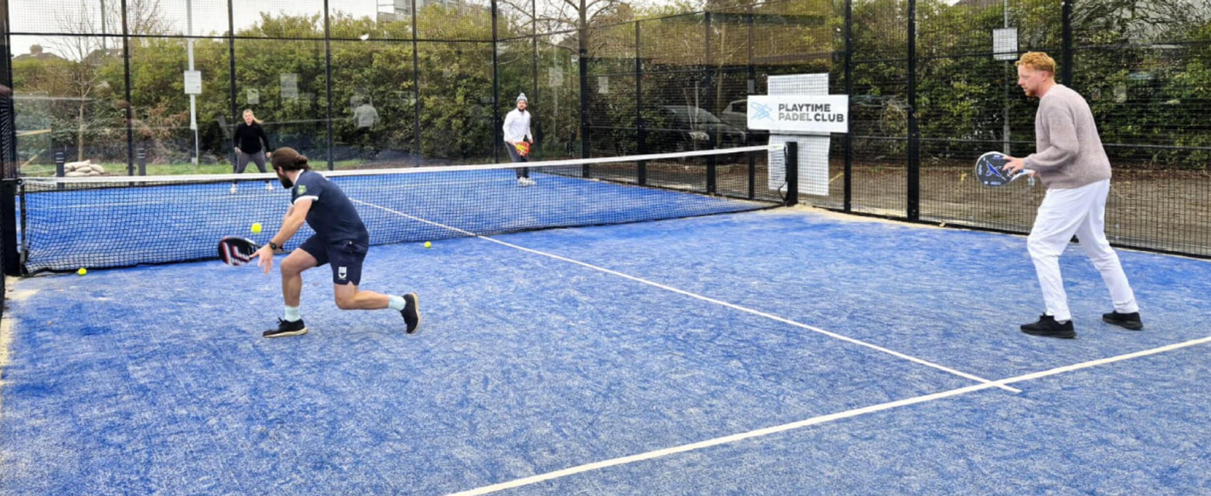 4 people play Padel on a Padel court