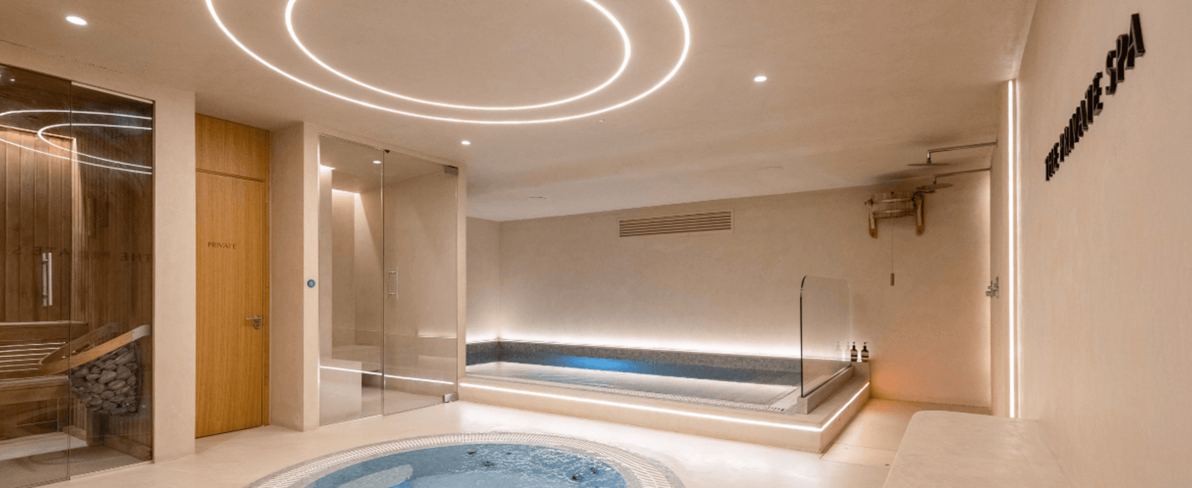 Inside a spa, showing a plunge pool and sauna