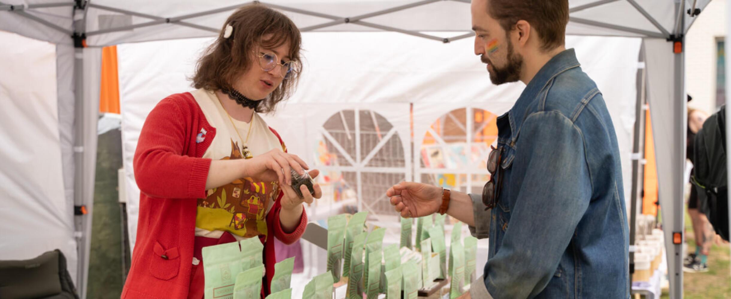 Two people at a market stall