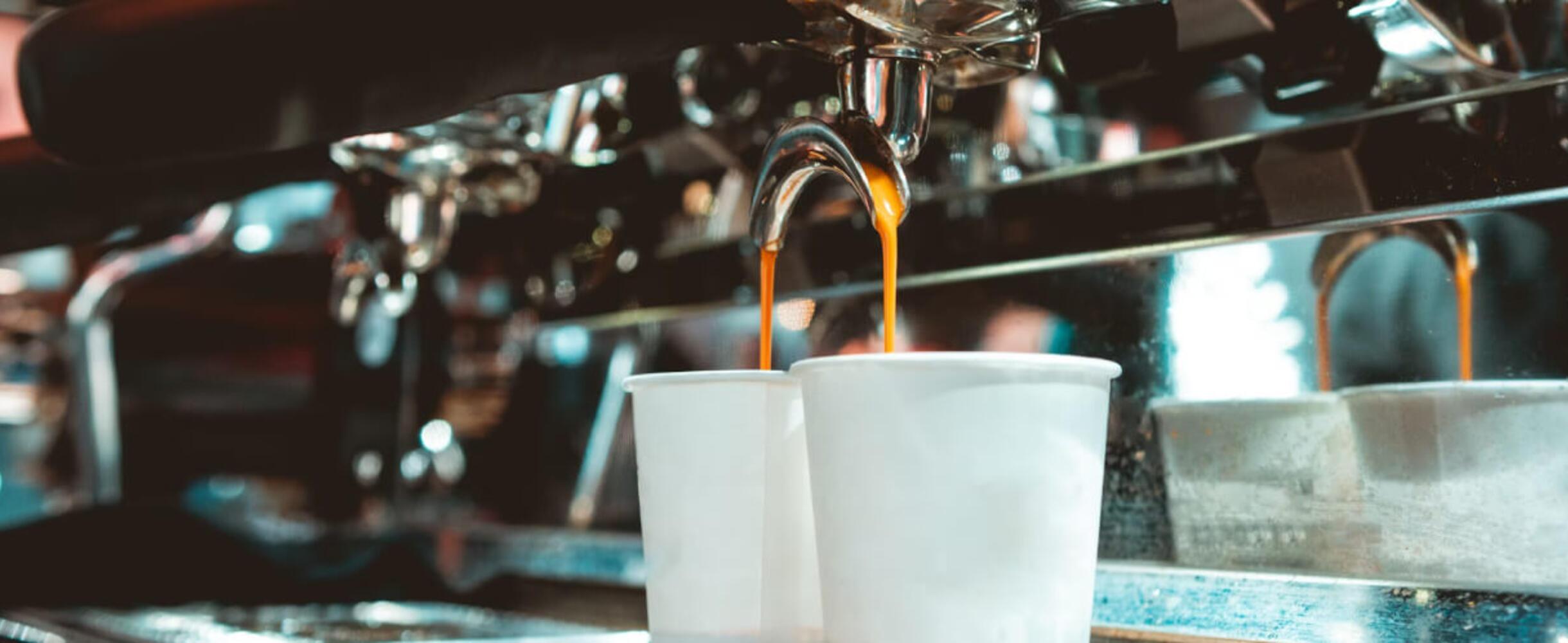 coffee pouring into paper cups