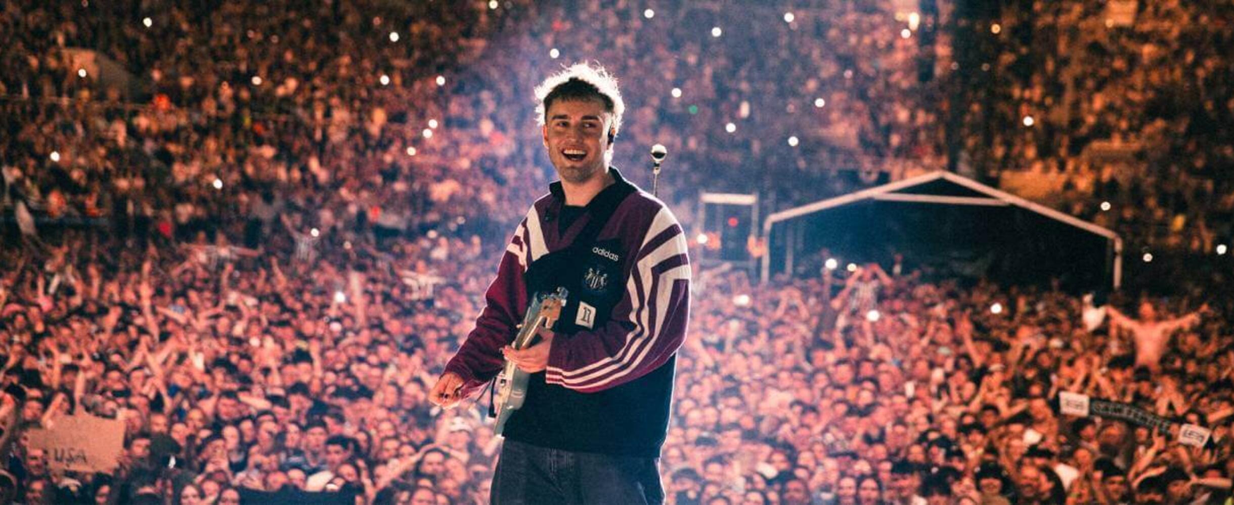 Sam Fender performing on stage