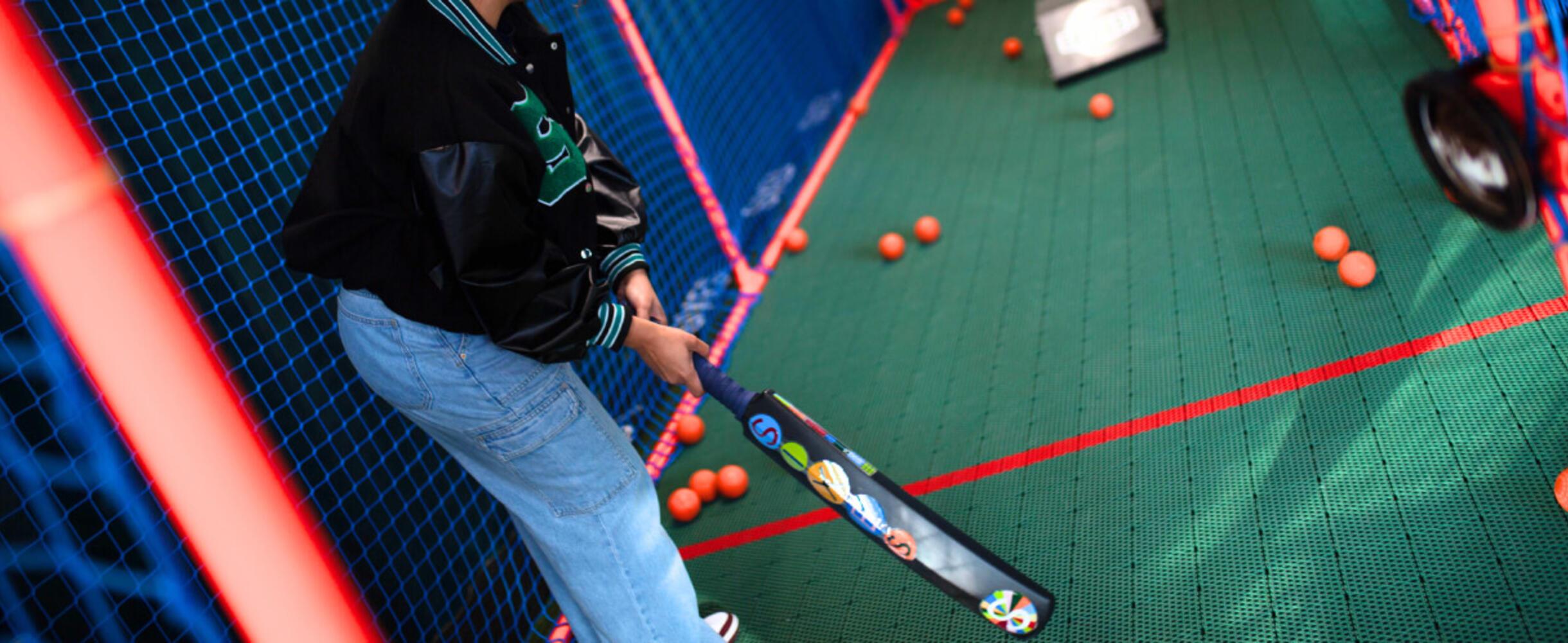 A person holds a cricket bat