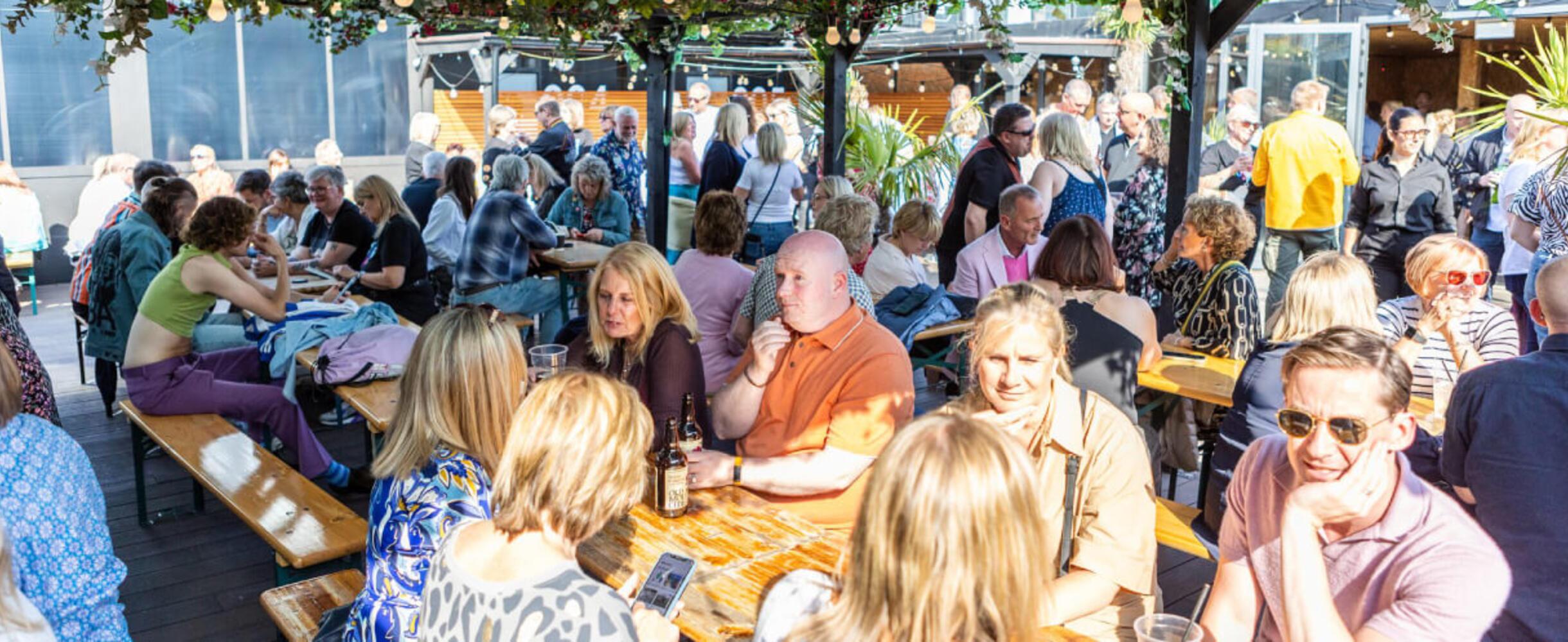 A crowd of people at the terrace area of Snoozebox