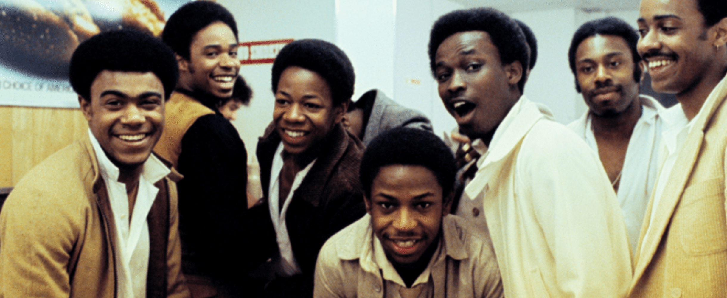 A photo from the 1970s showing a group of young Black men smiling