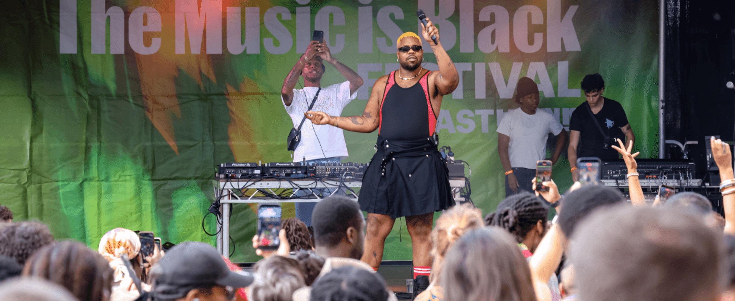 MNEK performs on stage