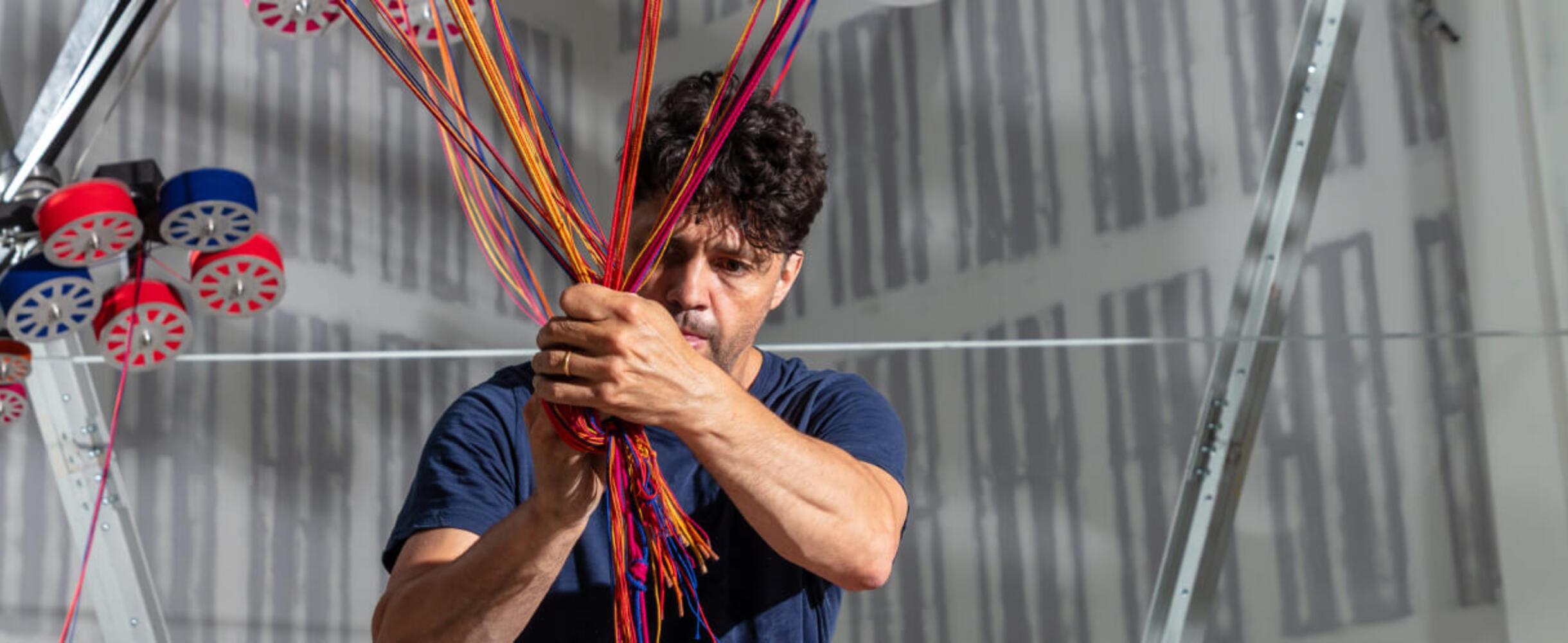 Artist Conrad Shawcross ties cord together