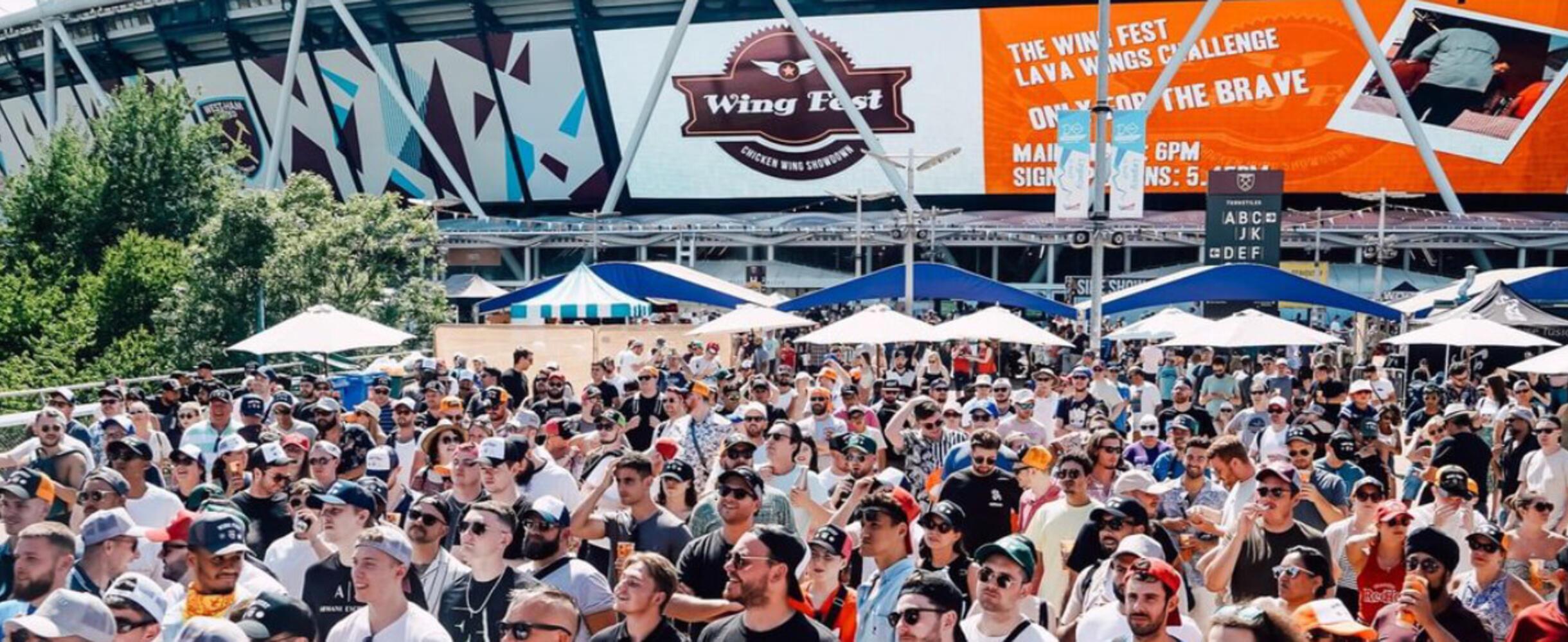 A large crowd in front of the London Stadium at Wing Fest