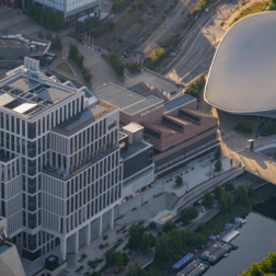 Photo of London Aquatics centre next to Sadler's Wells East, BBC, UAL, and V&A