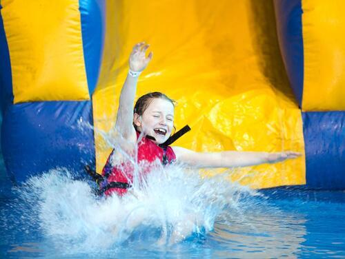 Girl sliding down water slide