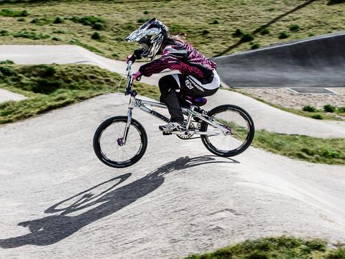 Girl riding BMX