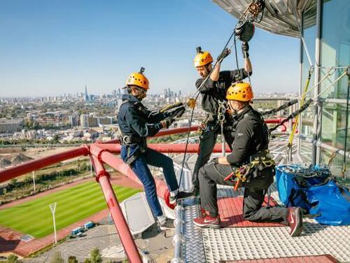 A group of people preparing to abseil down the ArcelorMittal Orbit