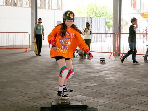 A girl skateboarding at East Summer School