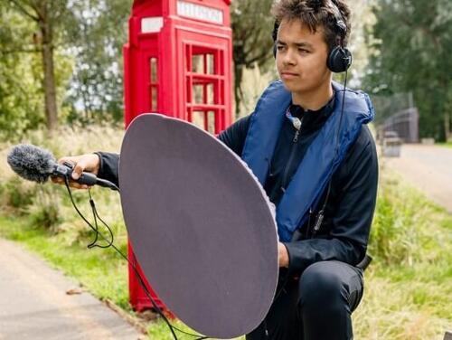 A boy doing media work at East Summer Schools