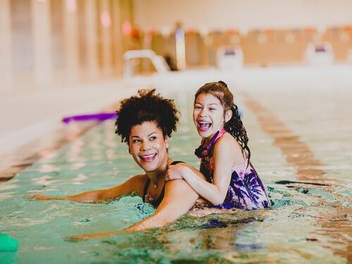 Mum and daughter in pool together