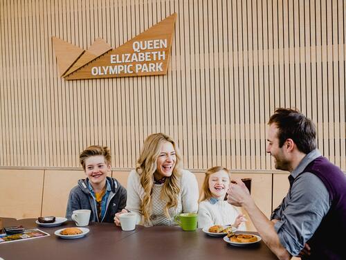 Family sitting at table eating 